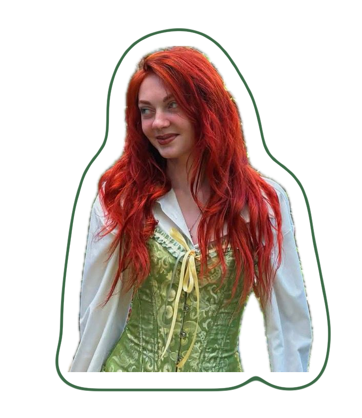 The birthday girl now, with long red hair and a green corset