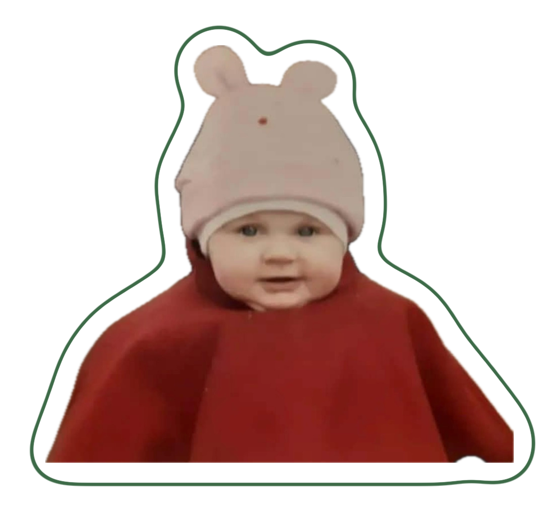 The birthday girl as a baby, in a bunny-ear hat and red cape